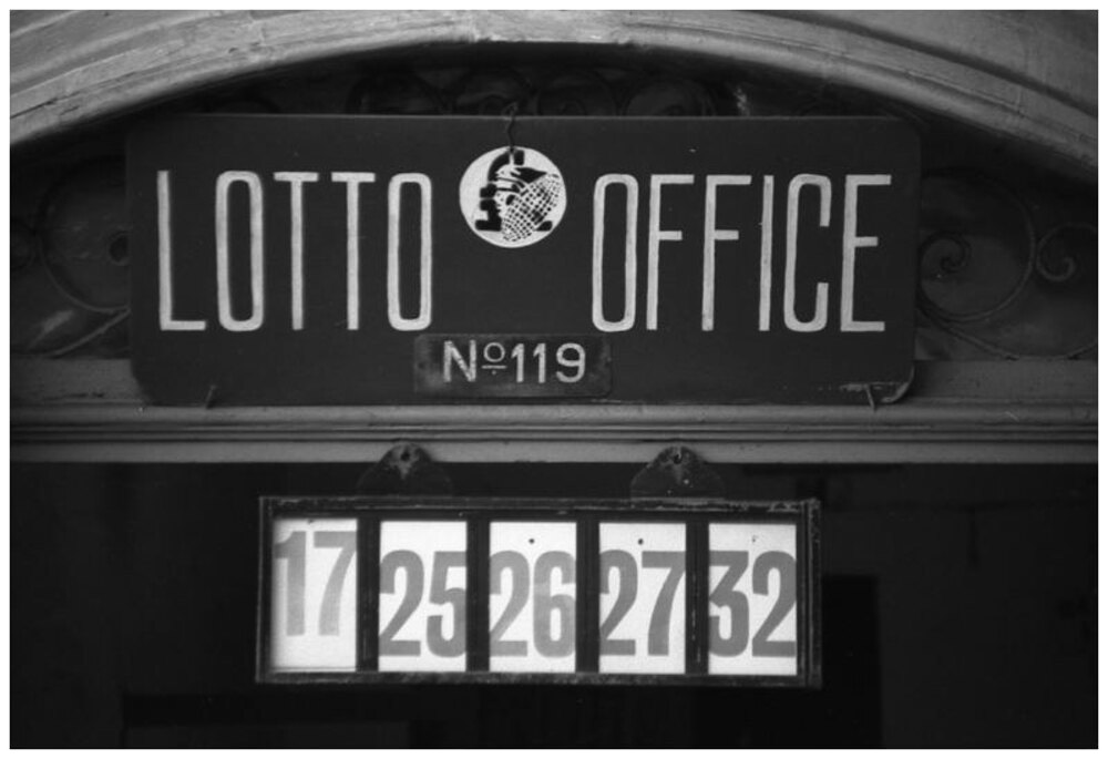 A historic Maltese lotto office with its vintage numbered draw board